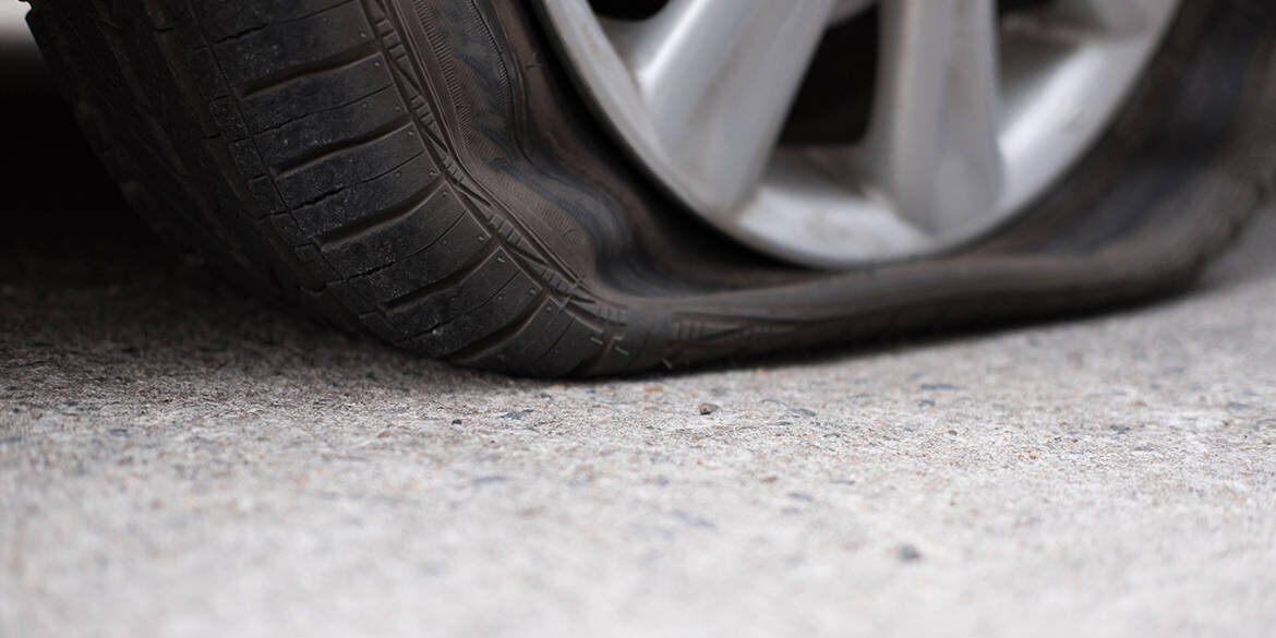 Car,Tire,Leak,Because,Of,Nail,Pounding.,Flat,Tyre,On