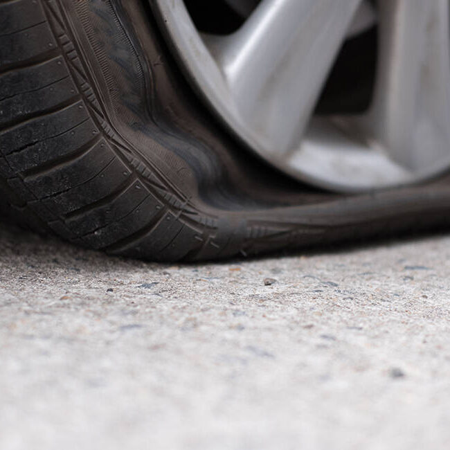 Car,Tire,Leak,Because,Of,Nail,Pounding.,Flat,Tyre,On